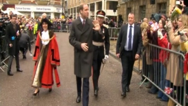 The Duke of Cambridge waves to the crowds.