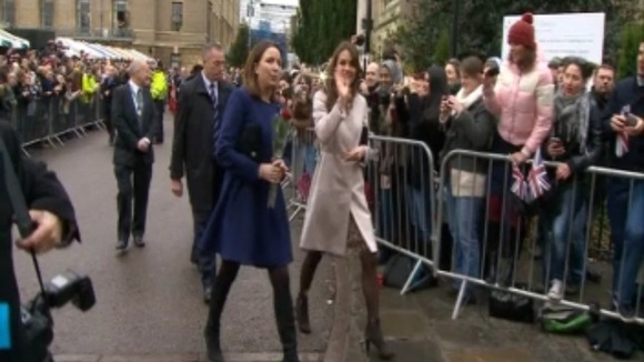 The Duchess of Cambridge waves to the crowds.