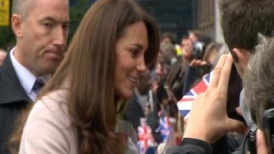 The people of Cambridge hold their British flags.
