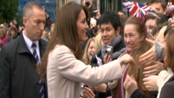 The crowd are delighted to catch a glimpse of the Duchess.