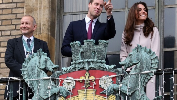 The Royal couple appear on the balcony of the Guildhall in Cambridge.