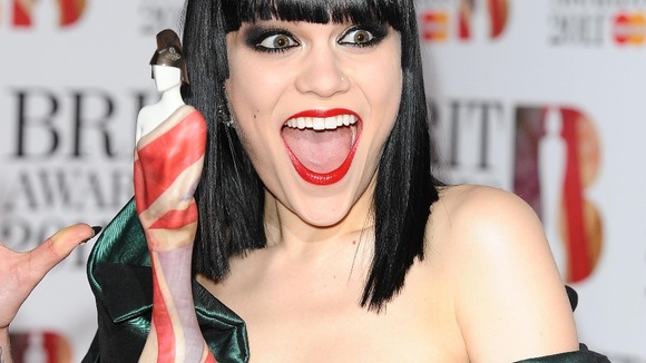 Jessie J holding last year's Brit Awards statue, designed by Dame Vivienne Westwood