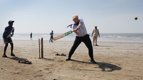 London's Mayor plays cricket with local Mumbai school boys on Juhu Beach.