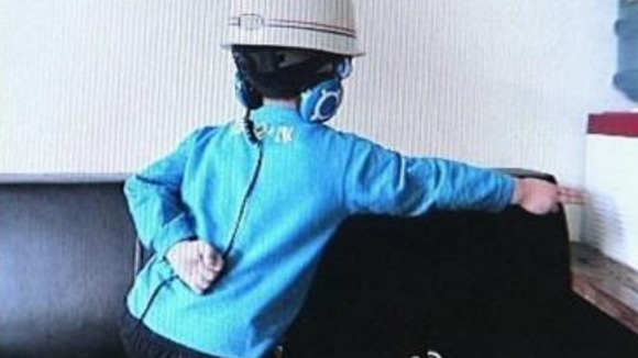 A girl does the 'carrier-style' pose
