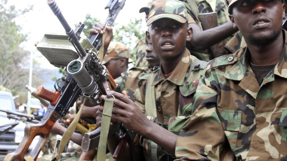 M23 rebels sit in truck in Goma in the eastern DRC on November 20