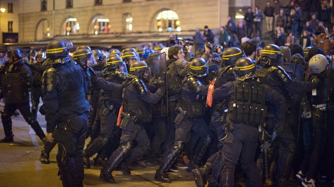 Protesters demonstrated against Le Pen and Macron.