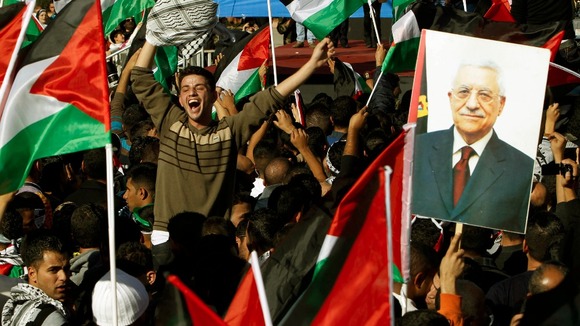 Palestinians celebrate the UN General Assembly's upgrading of their status