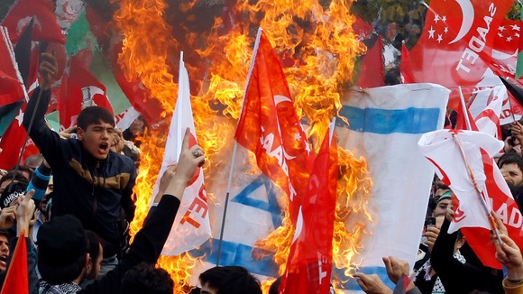 Supporters of the Saadet (Felicity) Party burn an Israeli flag as they shout anti-Israel slogans during a protest in Istanbul.
