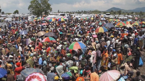 People crowd waiting to hear their names called for aid distribution 