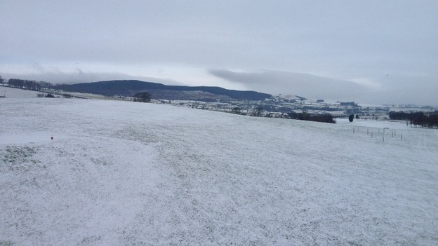 Across Rothbury Golf Course with Simonside Hills in the background