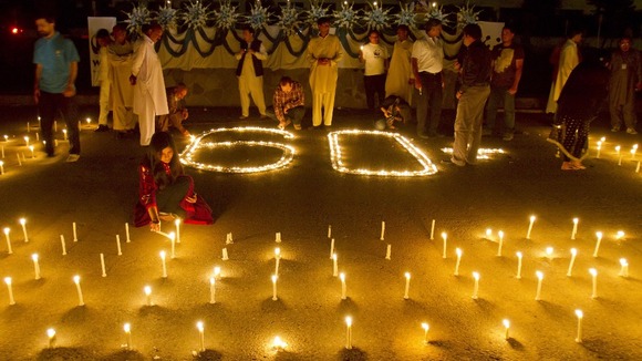 Participants in Islamabad, Pakistan take part inn Earth Hour