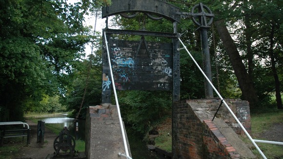 The lock gate has been damaged by vandals over the years