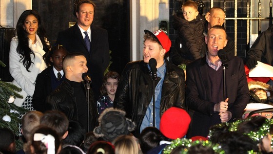 David Cameron watches the X Factor finalists singing outside Number 10