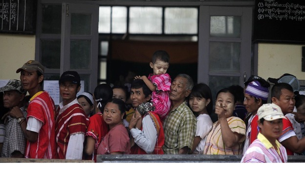Myanmar villagers line up to cast their vote outside a polling station in Wah Thin Kha, Myanmar