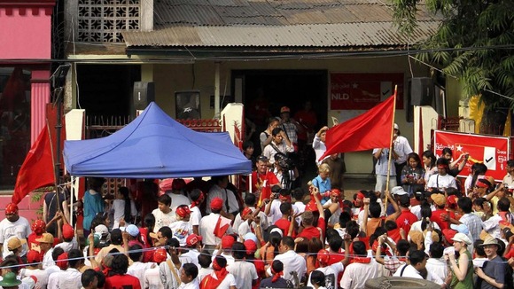 Supporters of Myanmar democracy leader Aung San Suu Kyi's National League for Democracy gather outside the party headquarters today.