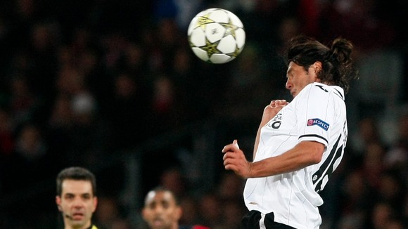 Valencia forward Valdez heads the ball during the Group F match against Lille