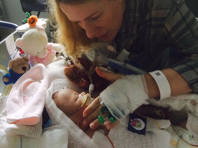 Rachel Norey at Matilda's bedside shortly after her birth.