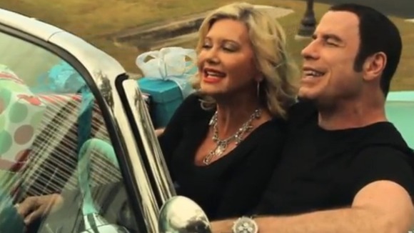 John Travolta and Olivia Newton-John sing their way to Christmas