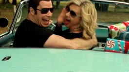 John Travolta and Olivia Newton-John sing their way to Christmas