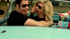 John Travolta and Olivia Newton-John sing their way to Christmas