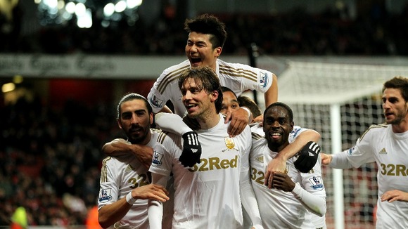 Swansea City celebrate at Arsenal