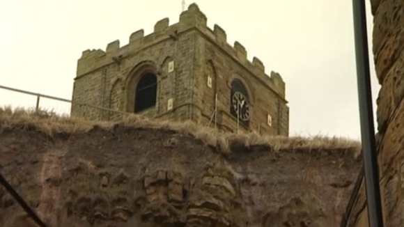 Earth from this collapsed cliff face near the Kipper smokehouse in Whitby is inching towards buildings and businesses below.
