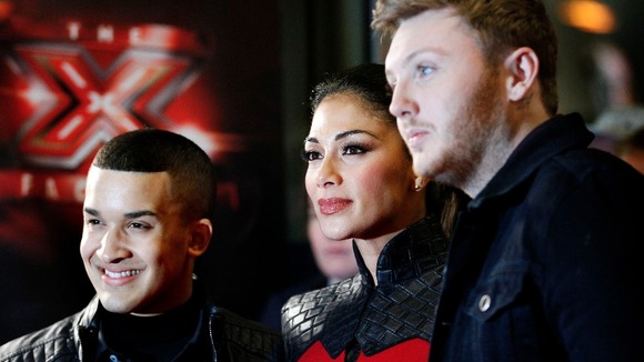 X Factor judge Nicole Scherzinger with finalists James Arthur, right, and Jahmene Douglas