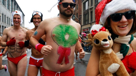 Runners embrace the festive theme of the charity run in the Back Bay neighborhood of Boston.