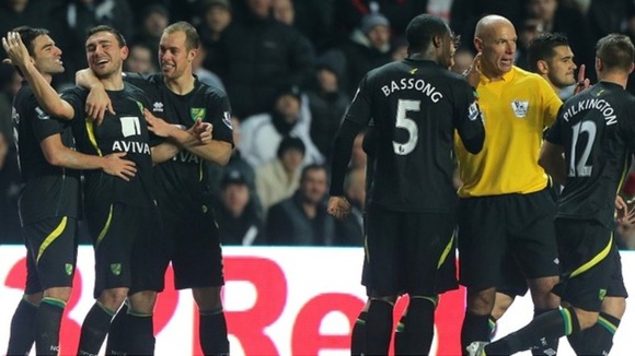 Sebastien Bassong spoke to Howard Webb after celebrating his side's fourth goal in the 77th minute.
