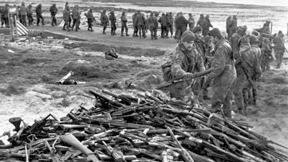 Argentinian forces hand over their weapons near Port Stanley following their surrender.