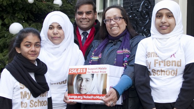Shahida Choudhry (second right) and Birmingham MP Perry Bar Khalid Mamood deliver a 256,000-name petition to Downing Street.