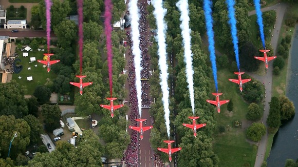 The Red Arrows fly across Queen Victoria Memorial next to Buckingham Palace on September 10