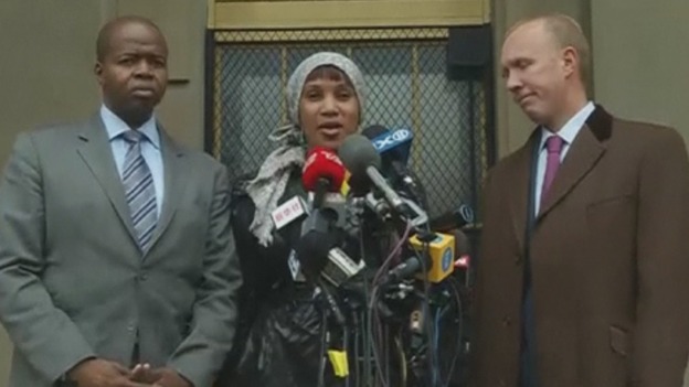 Nafissitao Diallo with her lawyers on the court steps