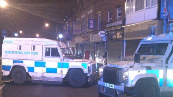 UTV's Jane Loughrey says a patrol car was attacked with iron bars and then a petrol bomb was thrown inside.