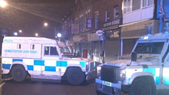 UTV's Jane Loughrey says a patrol car was attacked with iron bars and then a petrol bomb was thrown inside.