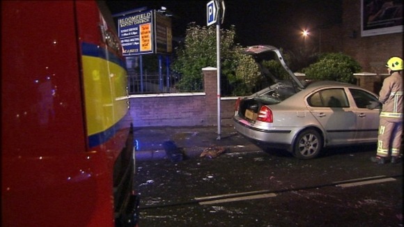 The police car was attacked while an officer was still inside