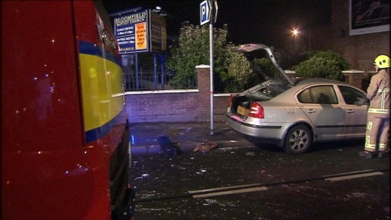 The police car was attacked while an officer was still inside