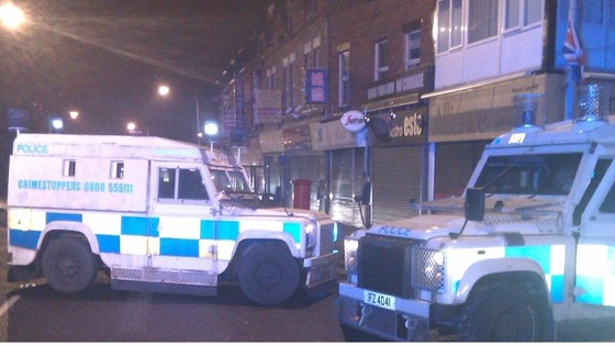 The Alliance Party office is surrounded by police cars.