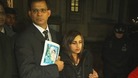 Benedict Barboza holds a picture of his wife, Jacintha Saldanha, and stands with their daughter outside the House of Commons