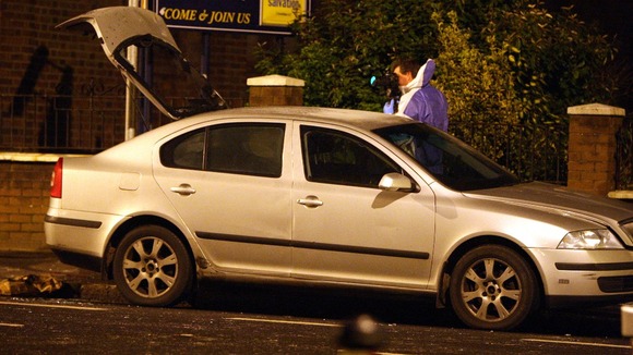 The police car hit by a petrol bomb during another round of violence in Belfast