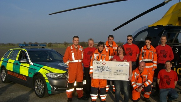 The MAGPAS team receives a cheque for £5,000