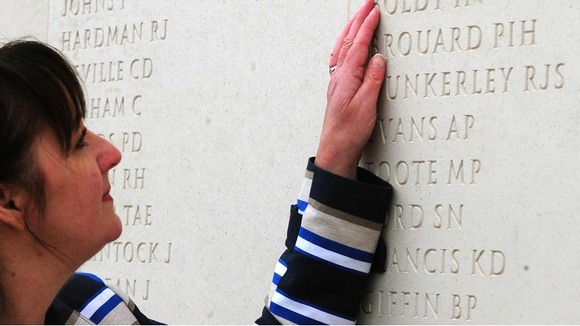 Margaret Allen touches the name of her late husband, Able Seaman Iain Boldy at the National Memorial Arboretum in Staffordshire.