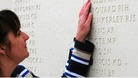 Margaret Allen touches the name of her late husband, Able Seaman Iain Boldy at the National Memorial Arboretum in Staffordshire. 