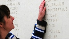 Margaret Allen touches the name of her late husband, Able Seaman Iain Boldy at the National Memorial Arboretum in Staffordshire. 