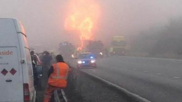 Huge flames surround the tanker after the crash