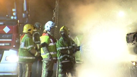 Firefighters dampen the fire 