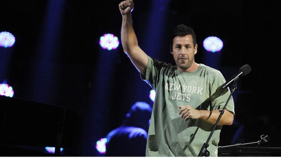 Adam Sandler performs during the "12-12-12" benefit concert