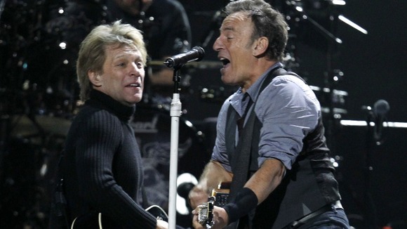 Jon Bon Jovi and Bruce Springsteen perform during "12-12-12" benefit concert