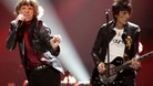 Mick Jagger and Ron Wood of the Rolling Stones perform during the "12-12-12" benefit concert