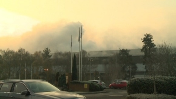 Smoke pours from fire